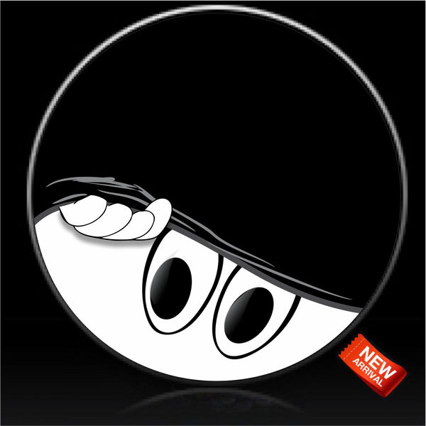Smiley eyes peeking from under tire cover