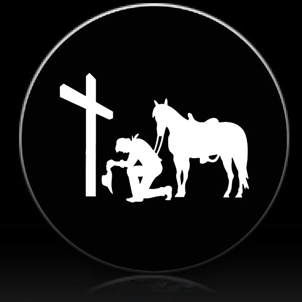 Cowboy praying at cross spare tire cover