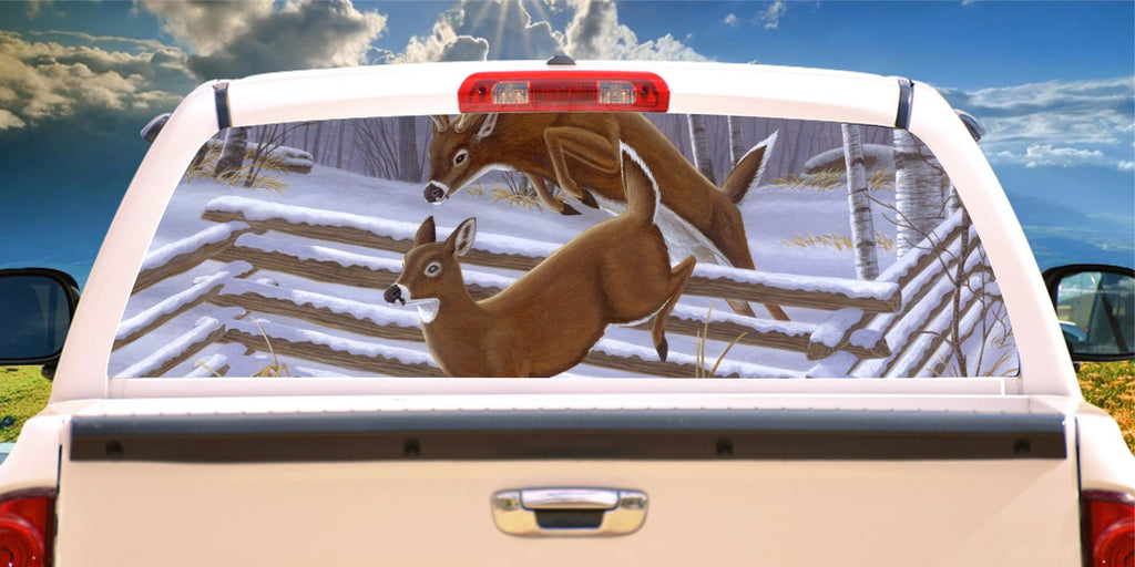 Deer jumping over snowy fence window mural decal