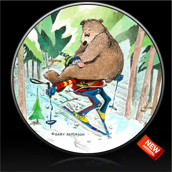 Skier trail blazing with a bear hanging on spare tire cover